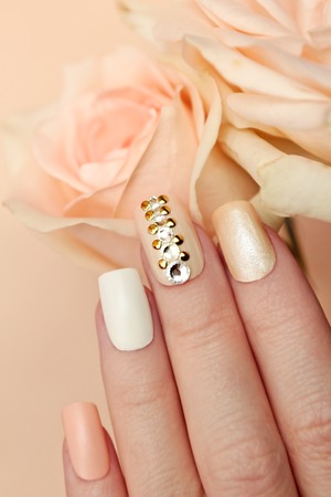 Multi-colored pastel manicure square shape with rhinestones.の写真素材