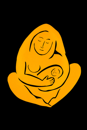 The work is carved from black and colored paper, which shows a couple of people the mother and child. The love and tenderness.の写真素材