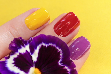Colorful trendy summer manicure for women's short nails.Nail art.