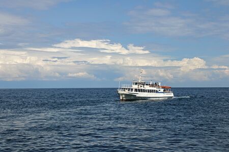 Seascape Blue sky with clouds and calm sea. People travel by sea in the summer.