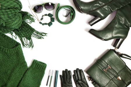 Fashion accessories, clothing and decorative cosmetics are green on a white background.の写真素材