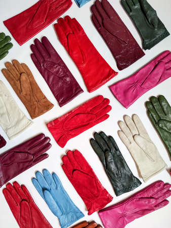 Collection of colored fashionable various leather gloves on a light background.の写真素材