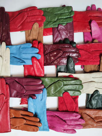 Collection of colored fashionable various leather gloves on a light background.の写真素材