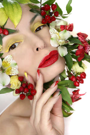 Multi-colored French manicure and makeup on the girl with red, green and yellow color.の写真素材
