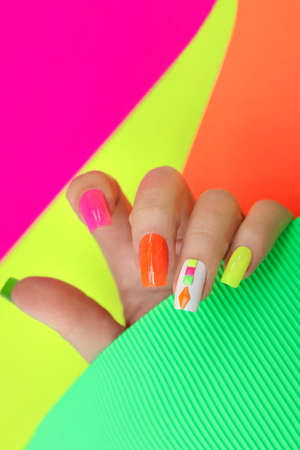 Bright illuminated multicolored manicureの写真素材