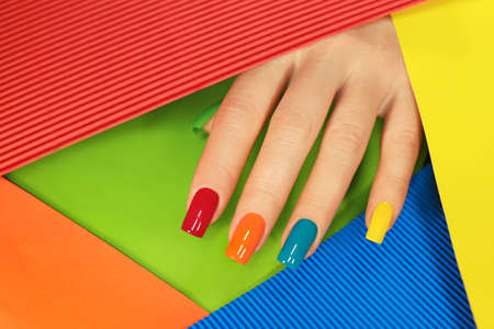 Multi-colored manicure on the square shape of the nails.の写真素材