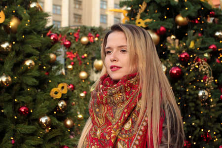 A beautiful girl with a Christmas treeの写真素材