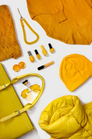 A collection of yellow fashionable wardrobe items .の写真素材