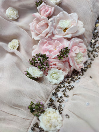 wedding bouquet of pink and white roses on a beige fabricの写真素材