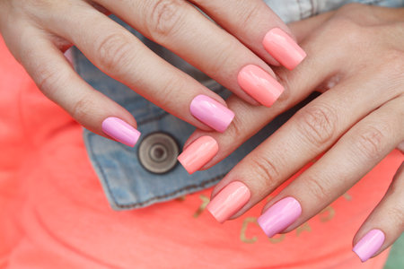 Multi-colored fashionable pastel manicure on square shaped nails.の写真素材