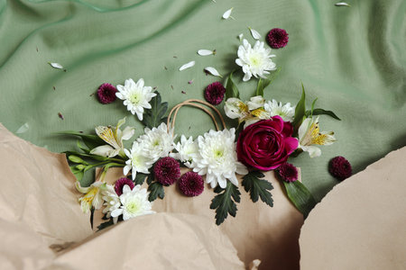 Bouquet of flowers on a green background. Flat lay.の写真素材