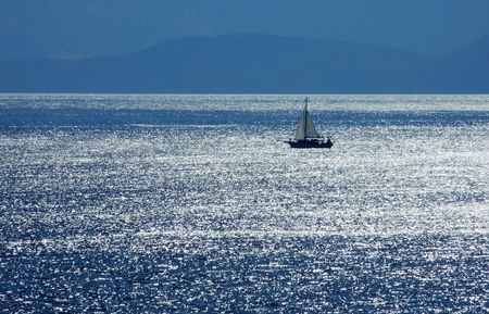 a boat sailing near Crete shoreline