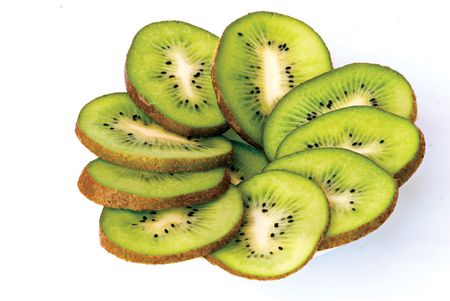 Slices of kiwi fruit isolated on white backgroundの写真素材