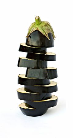 Pile of eggplant slices isolated on white backgroundの写真素材