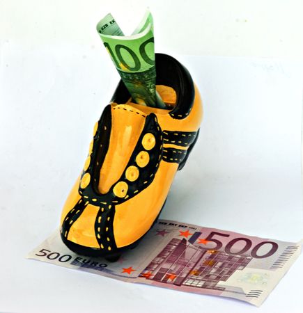 A cow the money bank on money pastureの写真素材