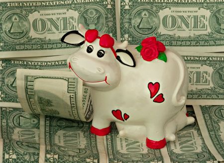 A cow the money bank on money pastureの写真素材