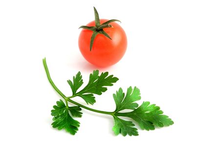 Tomatoes and parsley isolated on white backgroundの写真素材