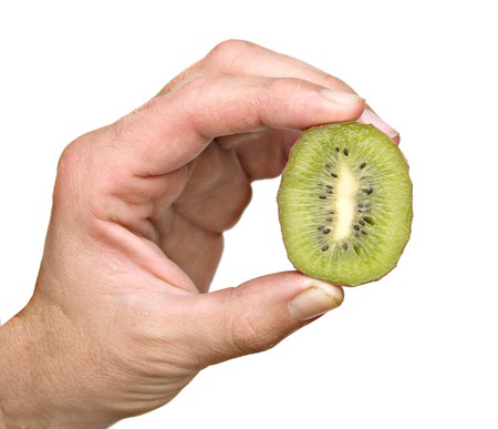 hand holding a section of kiwi fruitの写真素材