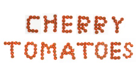 Inscription "tomatoes" performed from cherry tomatoesの写真素材