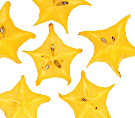 Sections of carambola isolated on white backgroundの写真素材