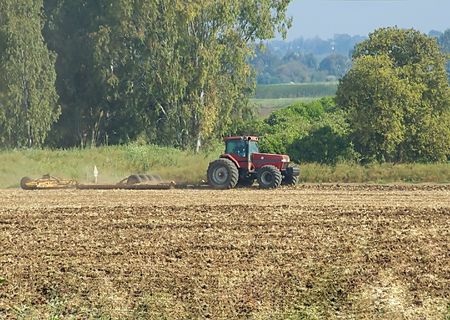 Tractor plowing field