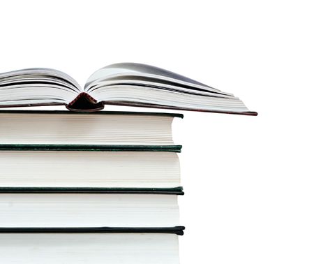 Open book and pile of books isolated on white backgroundの写真素材
