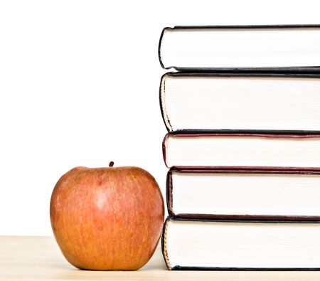 Red apple and books isolated on white backgroundの写真素材
