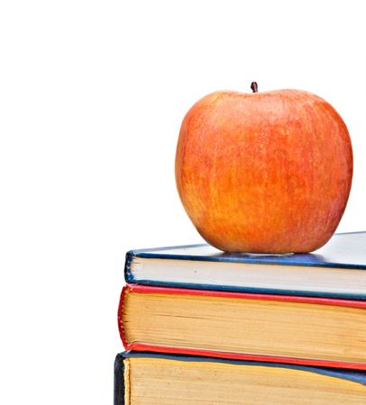 Red apple and books isolated on white backgroundの写真素材