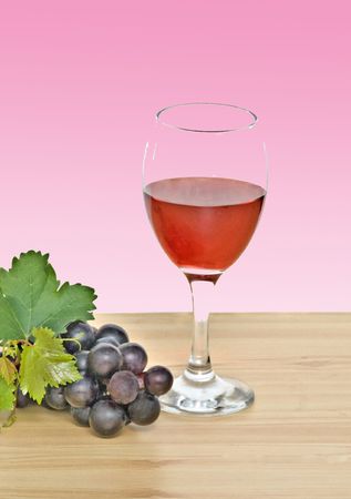Goblet  and grapevine on tableの写真素材