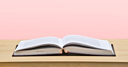 Open book on desk の写真素材