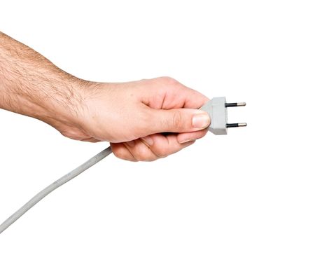 Hand with two-pin power plugの写真素材