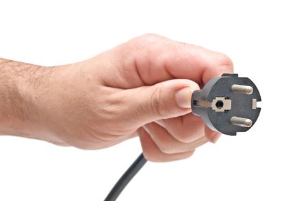 Hand with power plugの写真素材