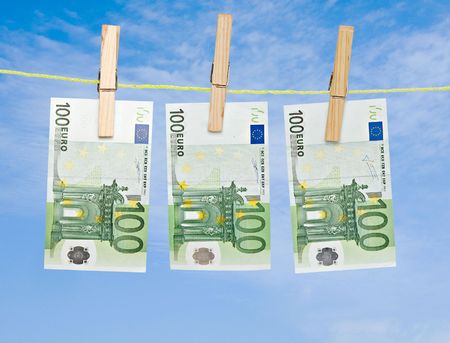 banknotes drying  on rope after laundryの写真素材