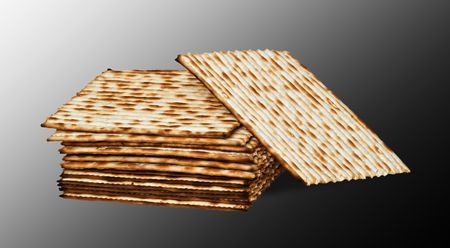 Close up of square matza isolated on white backgroundの写真素材
