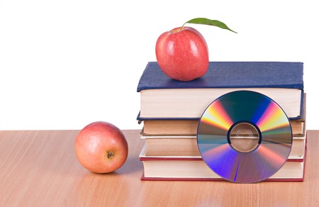 Apples, dvd, and  books as  symbols of transition fron old to new ways of learningの写真素材