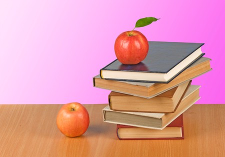 Red apple on  bookの写真素材