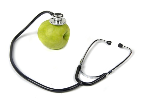 Green apple with stethoscopeの写真素材