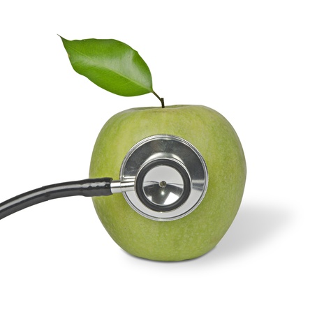 Green apple with stethoscopeの写真素材