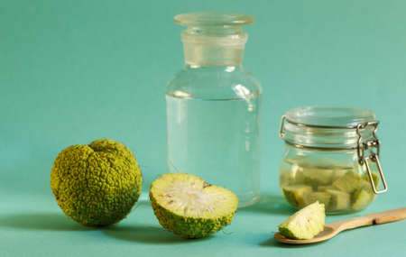 Green Osage Apple fruit, whole and sliced for making cosmetic lotions and medicinal tinctures