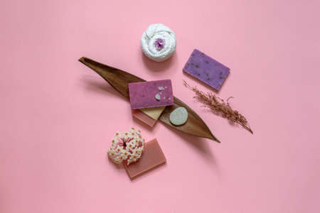 Composition in pink with handmade eco soap decorated with flowers. Top view with spaceの写真素材