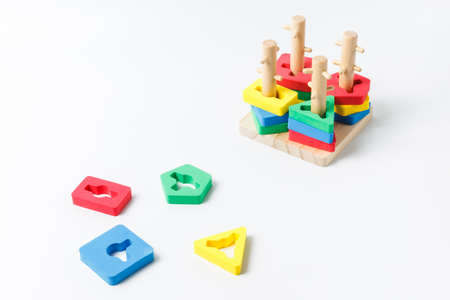Children's wooden toy, sorter, for the development of fine motor skills and logic. For educational...