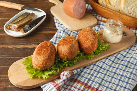 Scotch eggs. A traditional British snack. Boiled eggs, smeared with minced ham and anchovies and...