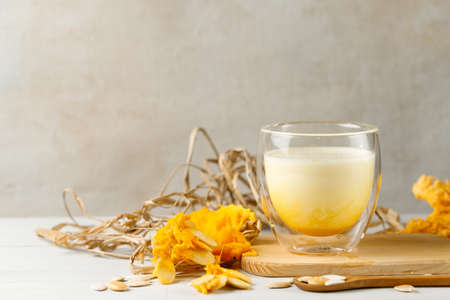 Alternative vegetable milk for delicious cocktails and healthy drinks. Pumpkin seed milk is safe for allergy sufferers. A glass with a milk drink in close-up on a light background, horizontal.の写真素材