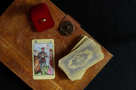 The layout of Tarot cards before making a difficult decision, getting married, getting engaged. A...