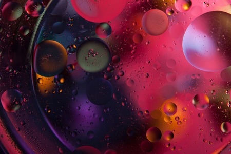 Beautiful abstract space background. Water drops of different coloursの写真素材