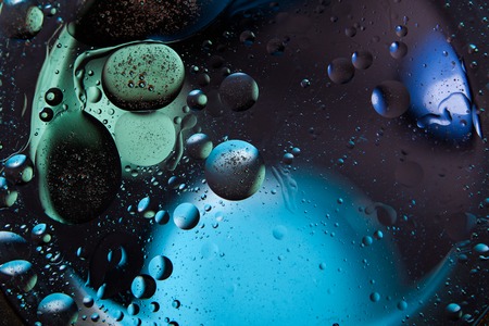 Beautiful abstract space background. Water drops of different coloursの写真素材