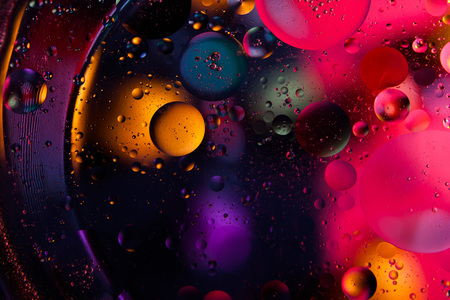 Beautiful abstract space background. Water drops of different coloursの写真素材