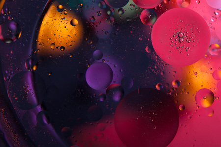 Beautiful abstract space background. Water drops of different coloursの写真素材