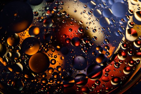 Beautiful abstract space background. Water drops of different coloursの写真素材
