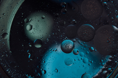 Beautiful abstract space background. Water drops of different coloursの写真素材